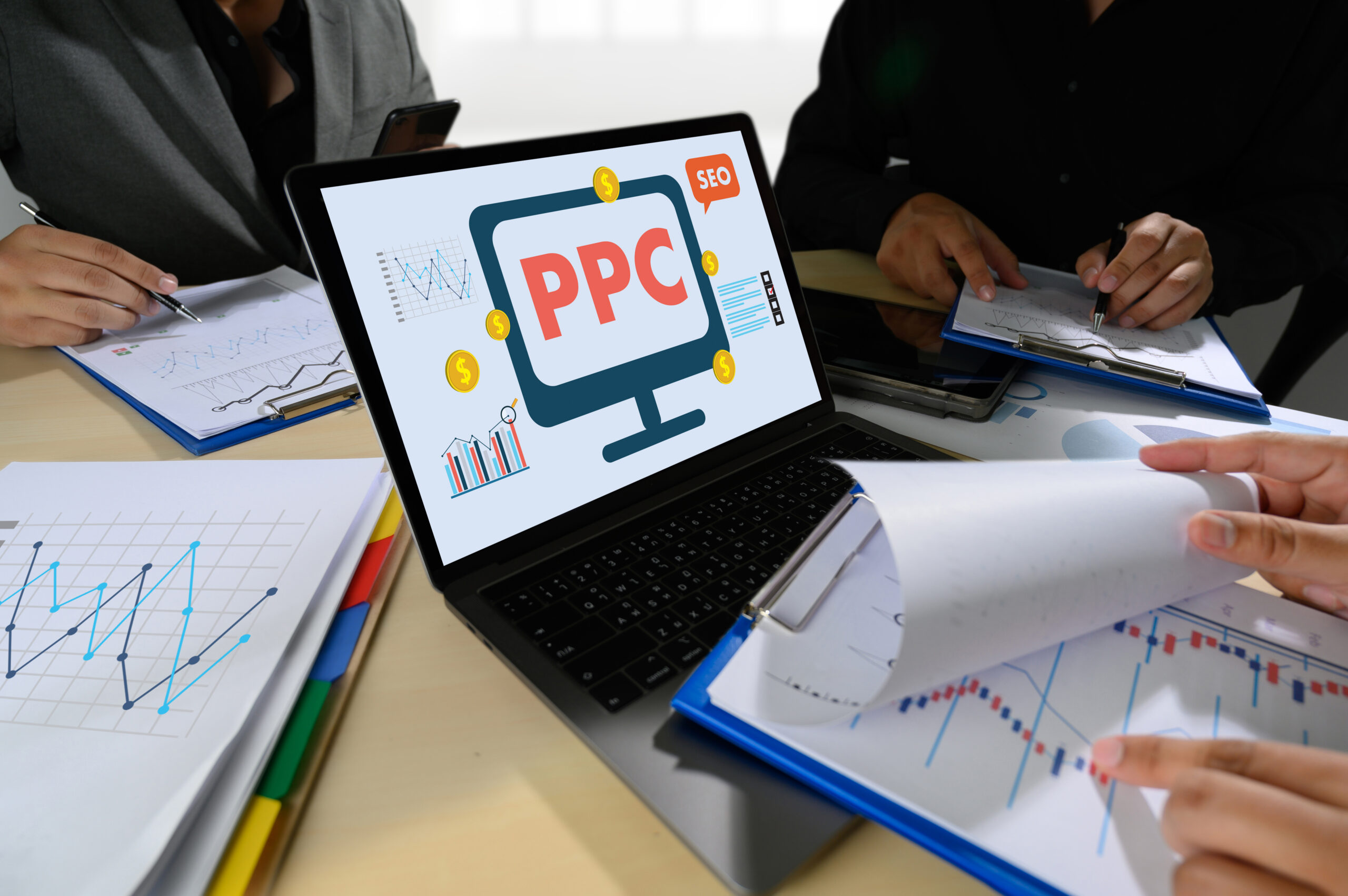  digital marketers monitoring the effectiveness of a non-profit organisation’s ppc campaign 