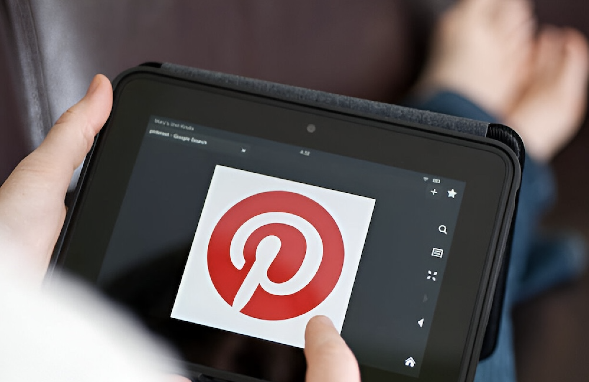 a person showing how to advertise on pinterest to reach marketing goals